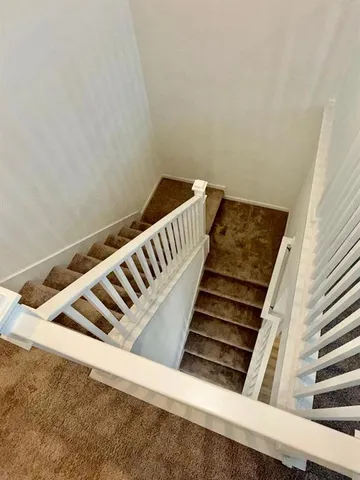 wooden floor in a hall with a window
