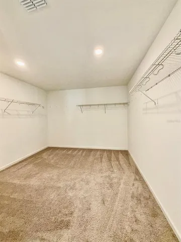 an empty room with a empty space and window