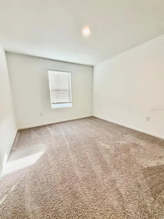 an empty room with a mirror