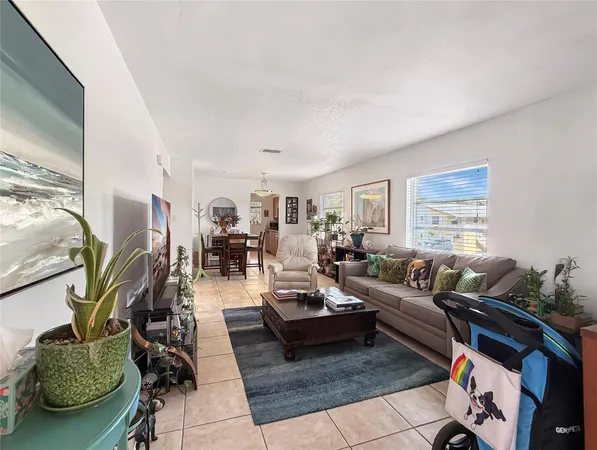 a living room with furniture rug and window