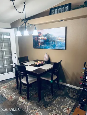a living room with furniture a fireplace and wooden floor