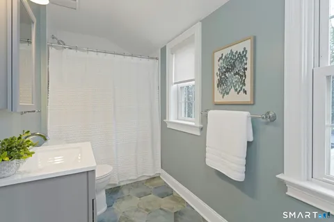 a room with a sink and a mirror