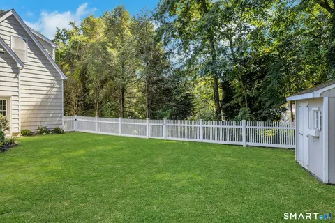 a view of a backyard with a small cabin