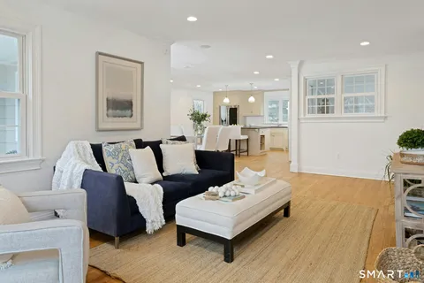 a living room with furniture rug and window