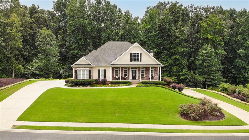 4651 Ridge Gate Drive Gainesville, GA 30506 - Photo 1 of 1 Welcome home to the timeless charm of a classic Southern home with TWO driveways...