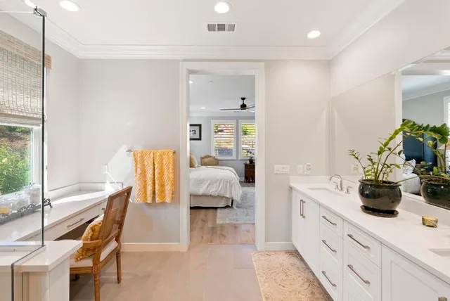 a spacious bedroom with a bed and a large window