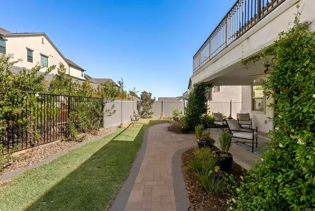 a view of a garden with sitting area