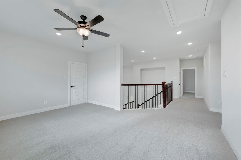 1103 Vista Way Rockwall, TX 75087 - Photo 18 of 26 a view of a hallway with a ceiling fan