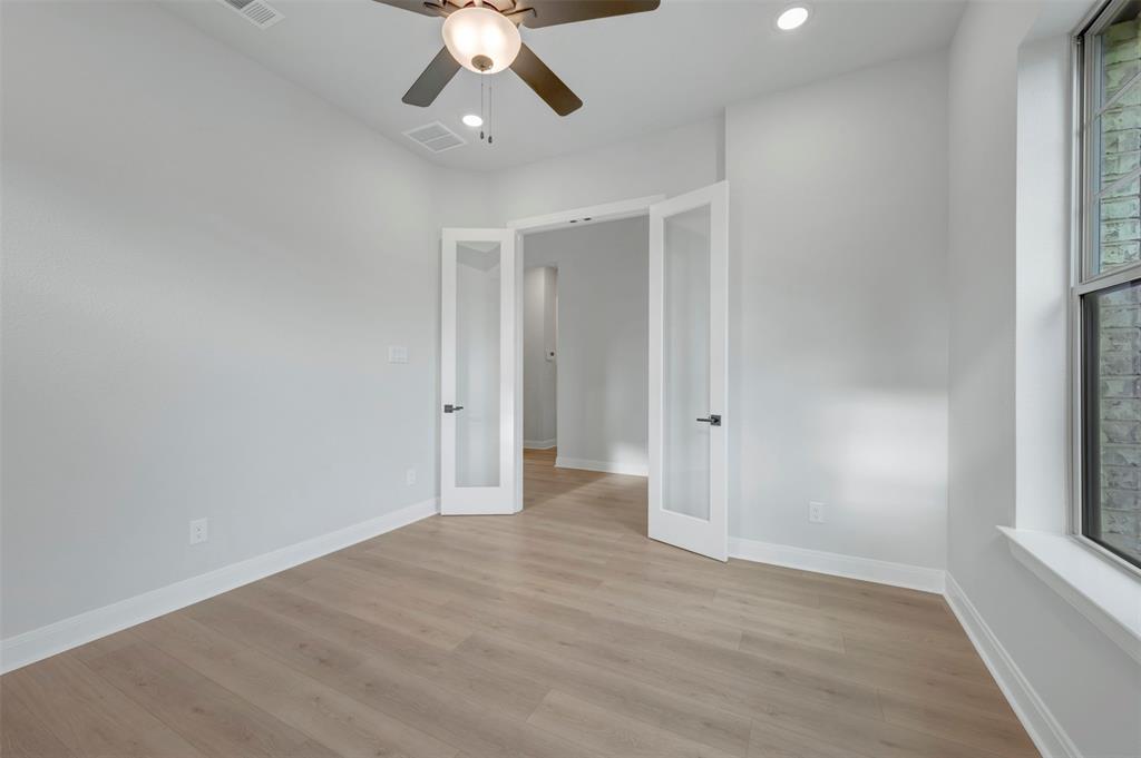1103 Vista Way Rockwall, TX 75087 - Photo 21 of 26 wooden floor in an empty room with a window