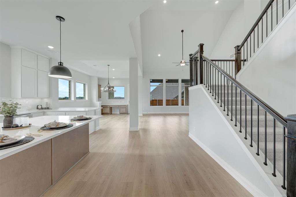 1103 Vista Way Rockwall, TX 75087 - Photo 26 of 26 a open kitchen with lots of counter space wooden floor and stainless steel appliances