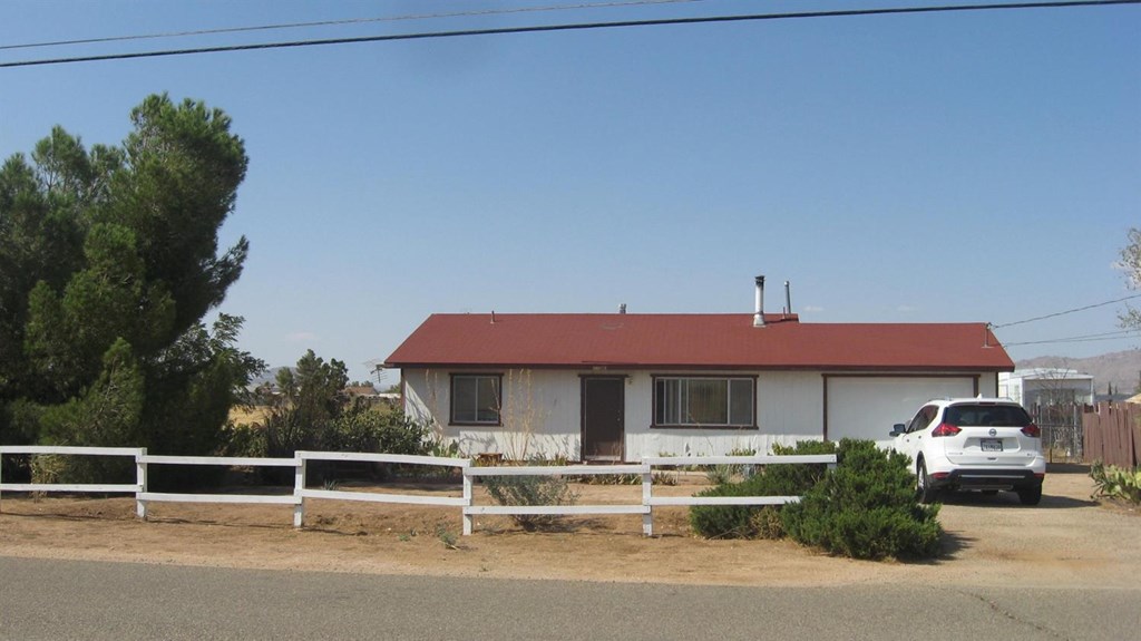 22840 Pahute Road Apple Valley, CA 92308 - Photo 1 of 1 a front view of a house with garden