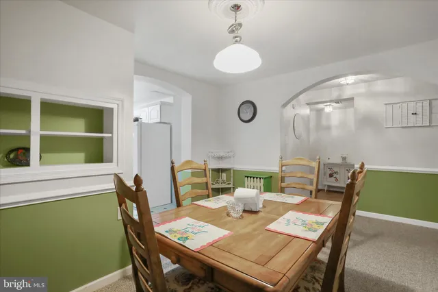 a spacious bedroom with a bed and a flat screen tv