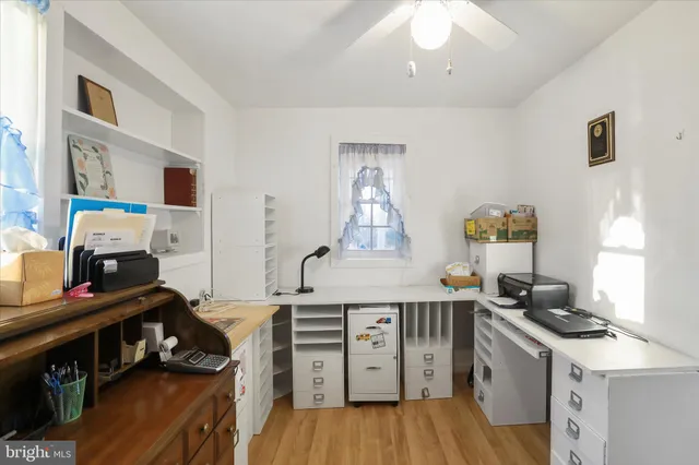 a kitchen with stainless steel appliances granite countertop a refrigerator sink and white cabinets