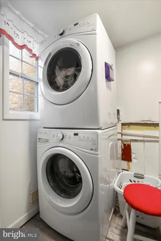 a view of a white house with a yard