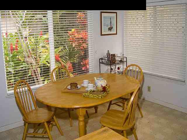 1667 South Kihei Road, Unit C Kihei, HI 96753 - Photo 3 of 5 a view of a dining room with furniture and wooden floor
