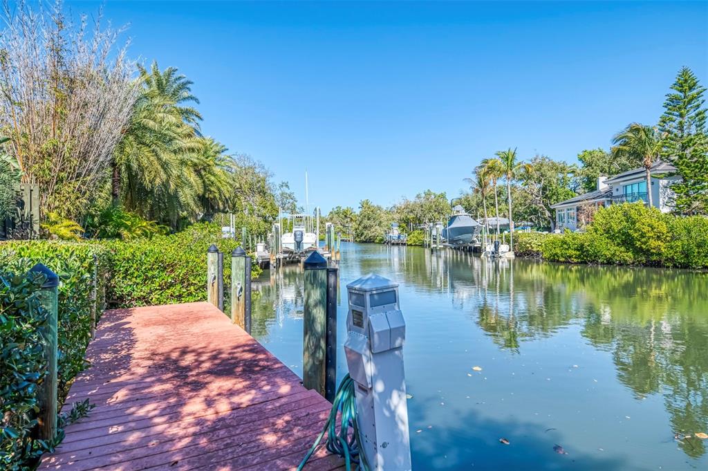 5303 Hidden Harbor Road Sarasota, FL 34242 - Photo 54 of 72 a view of a lake with a house in the background