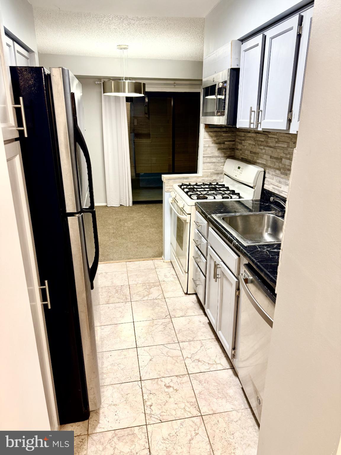 5 Suntop Court, Unit T1 Baltimore, MD 21209 - Photo 10 of 14 Modern kitchen with sleek finishes.