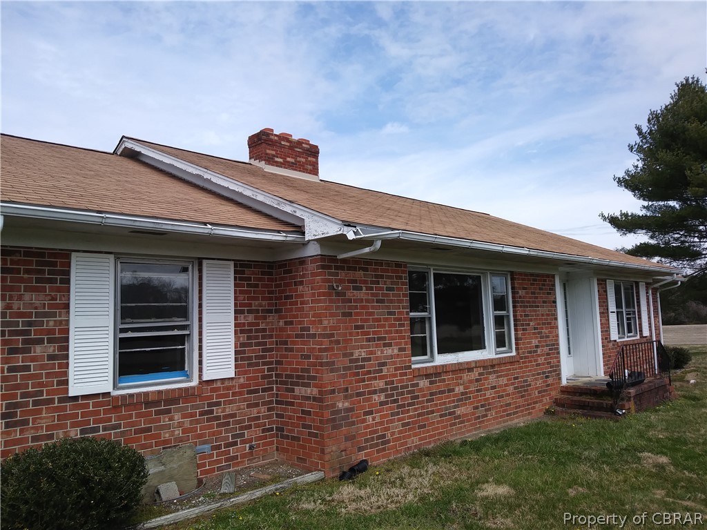 1498 Sharps Road Warsaw, VA 22572 - Photo 4 of 21 a front view of a house with a yard