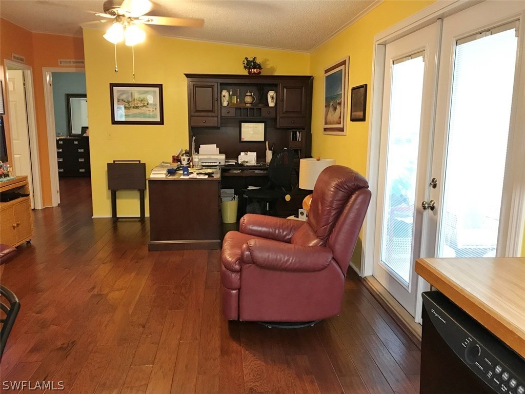 10441 Circle Pine Road North Fort Myers, FL 33903 - Photo 11 of 20 a living room with furniture and wooden floor