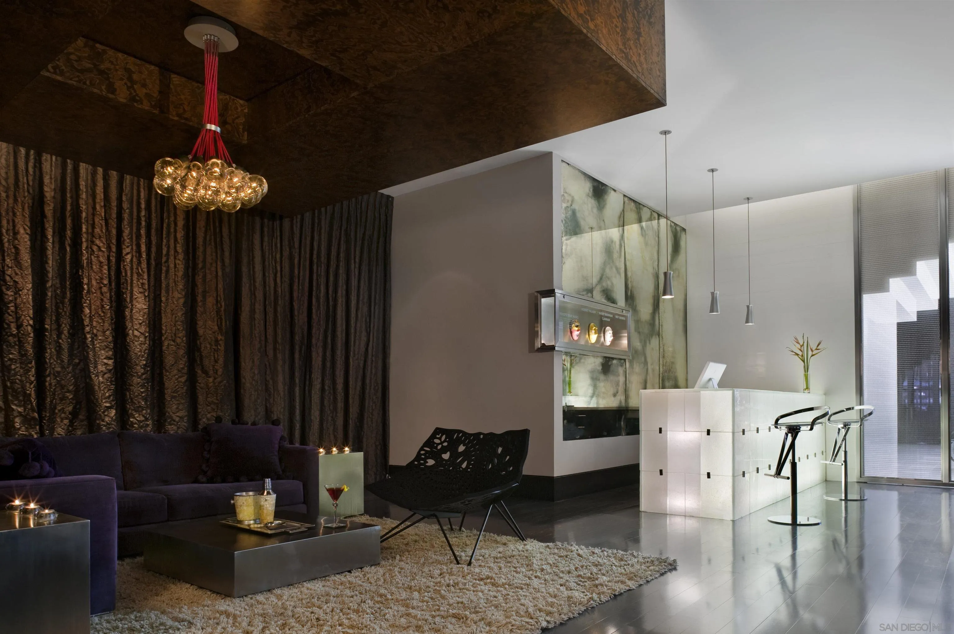 207 Fifth Avenue, Unit 507 San Diego, CA 92101 - Photo 8 of 12 a living room with furniture and wooden floor