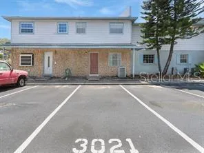 a front view of a house with a outdoor space