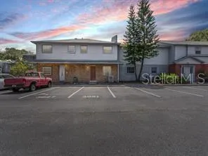 a red car parked in front of a building