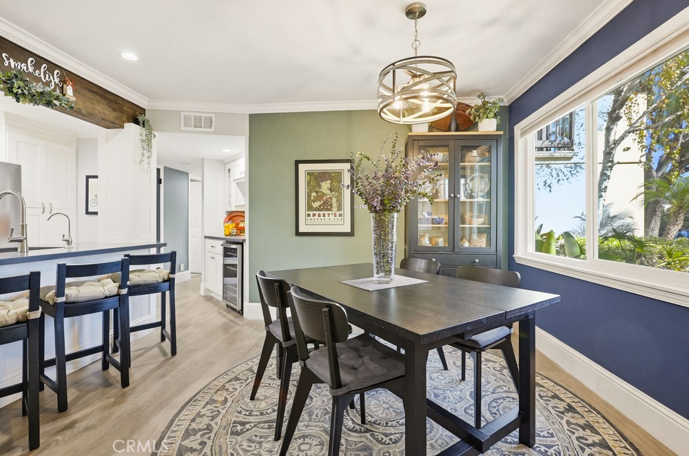 47 Vía Lavendera Rancho Santa Margarita, CA 92688 - Photo 11 of 40 a view of a dining room with furniture window and wooden floor