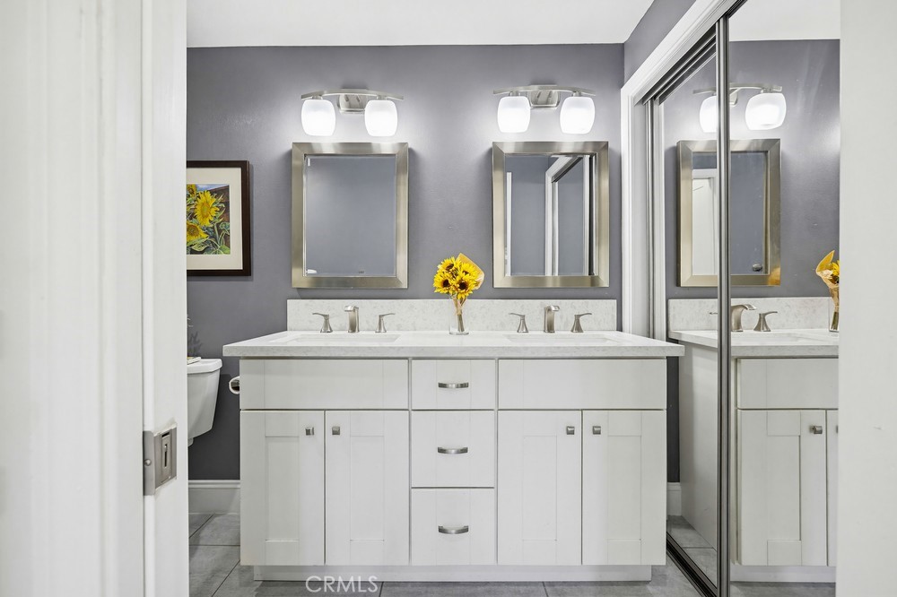 47 Vía Lavendera Rancho Santa Margarita, CA 92688 - Photo 25 of 40 a bathroom with a sink double vanity and a mirror
