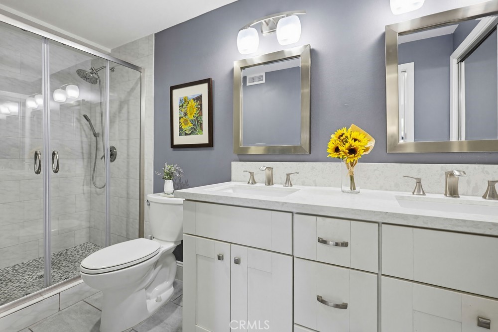 47 Vía Lavendera Rancho Santa Margarita, CA 92688 - Photo 26 of 40 a bathroom with a sink a toilet and shower