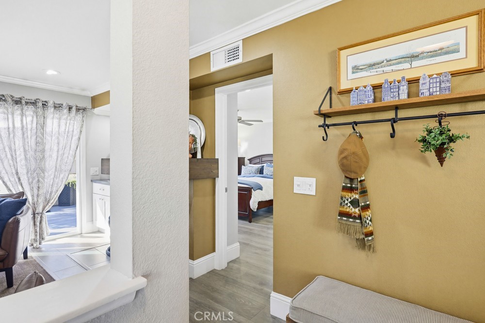 47 Vía Lavendera Rancho Santa Margarita, CA 92688 - Photo 6 of 40 a hallway with a door and a couch