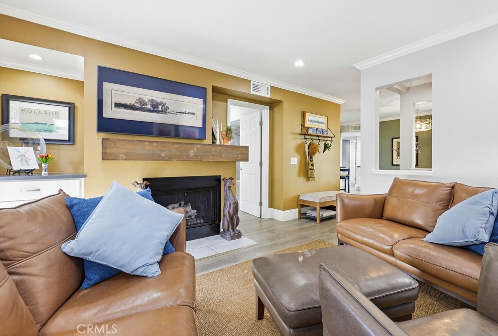 47 Vía Lavendera Rancho Santa Margarita, CA 92688 - Photo 10 of 40 a living room with furniture and a fireplace