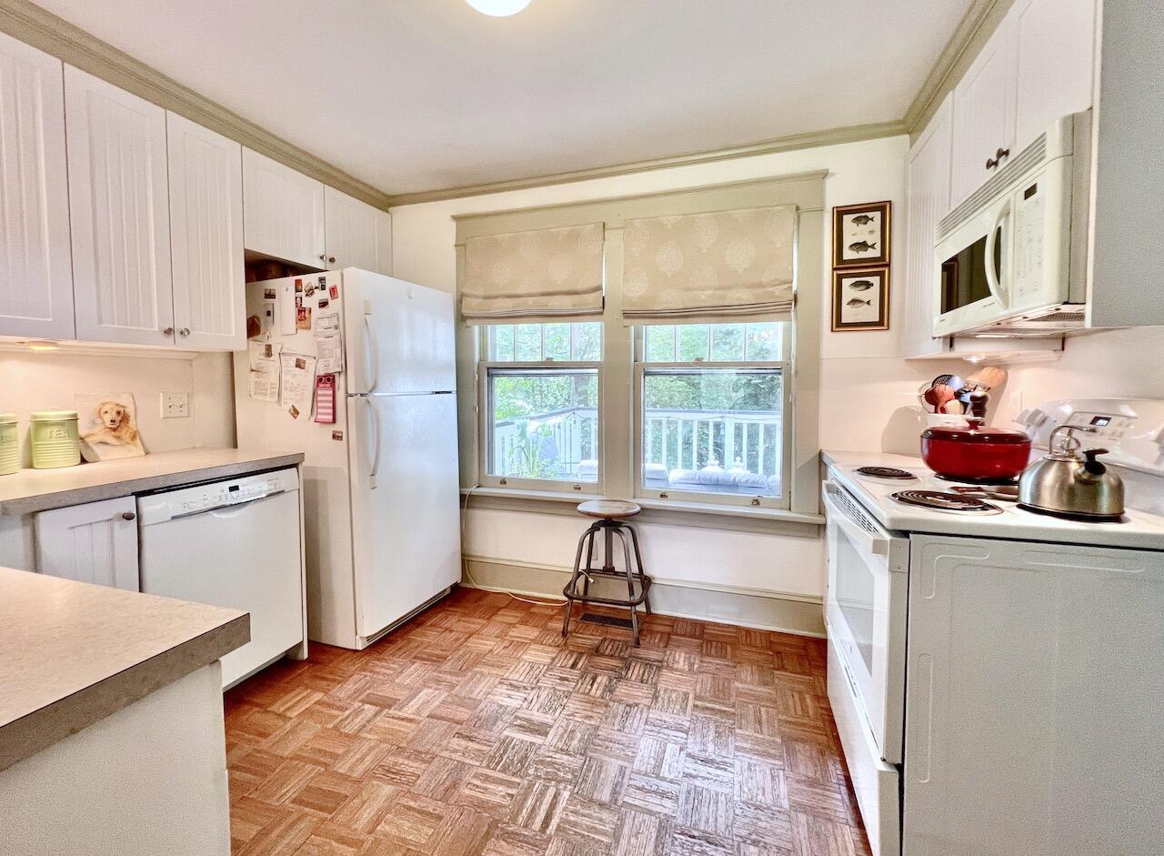 319 Rowayton Avenue Rowayton, CT 06853 - Photo 12 of 25 a living room with stainless steel appliances granite countertop a refrigerator and a sink with wooden floor