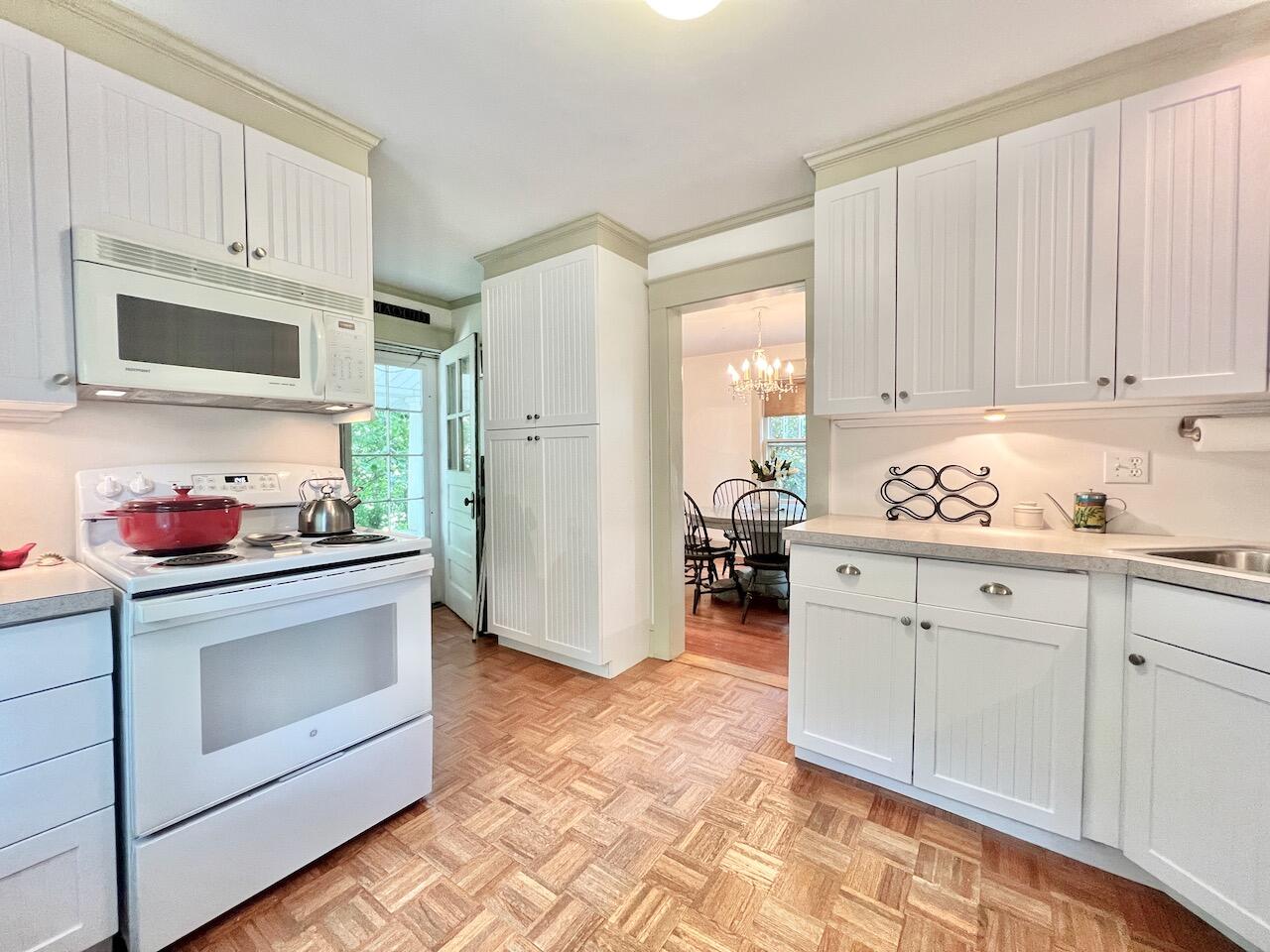 319 Rowayton Avenue Rowayton, CT 06853 - Photo 13 of 25 a kitchen with granite countertop white cabinets and white appliances
