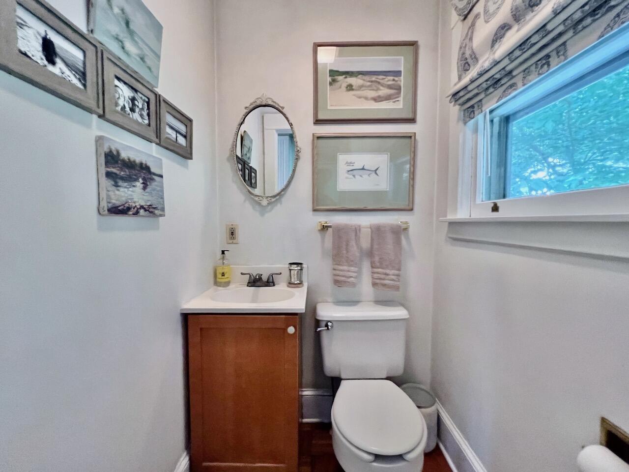 319 Rowayton Avenue Rowayton, CT 06853 - Photo 14 of 25 a bathroom with a toilet a sink and a mirror