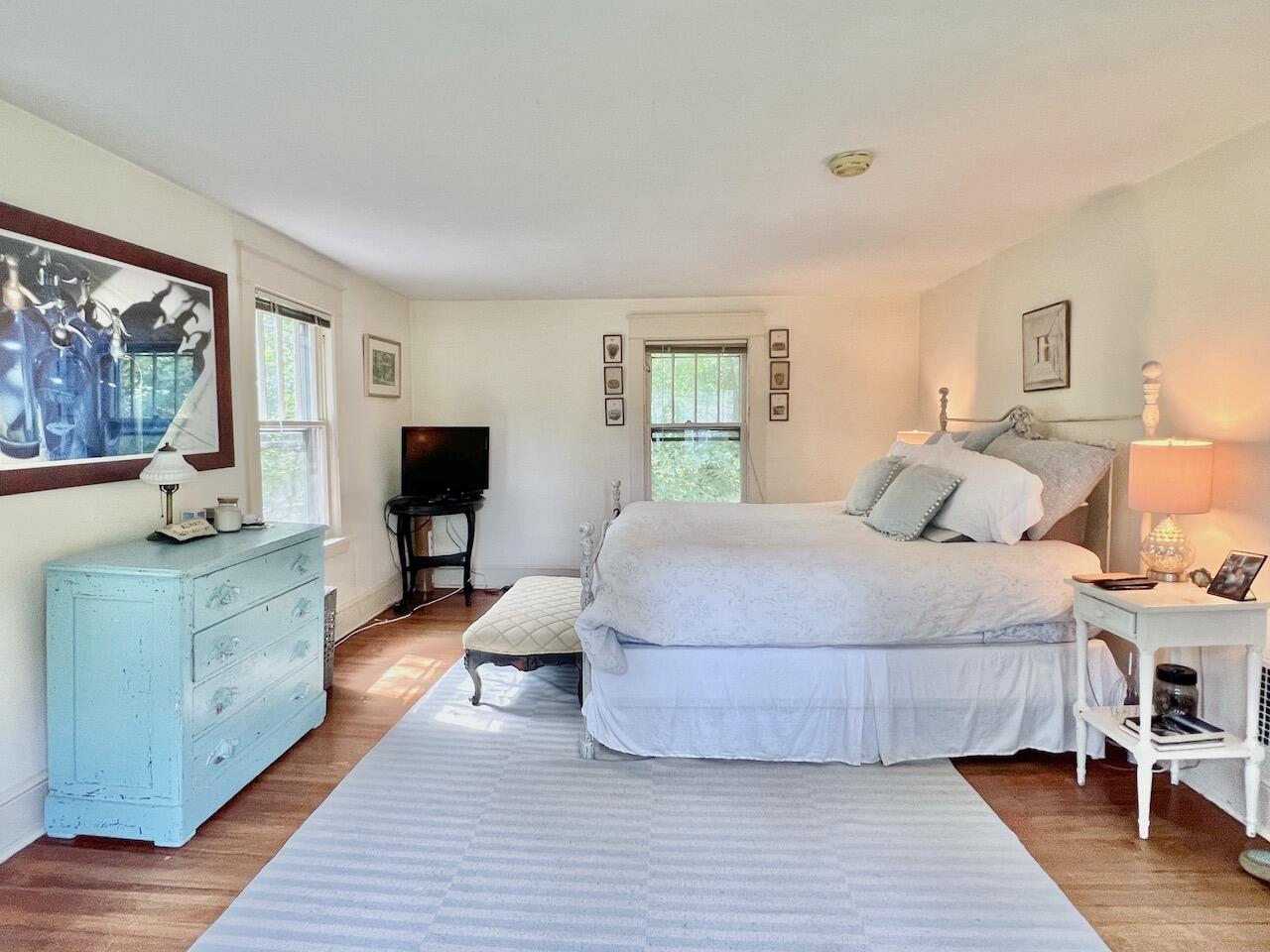 319 Rowayton Avenue Rowayton, CT 06853 - Photo 15 of 25 a bedroom with a large bed a flat tv screen and a dresser