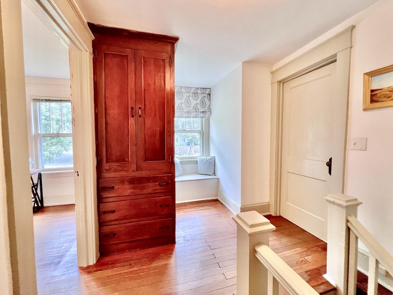 319 Rowayton Avenue Rowayton, CT 06853 - Photo 20 of 25 a view of a hallway with wooden floor and windows