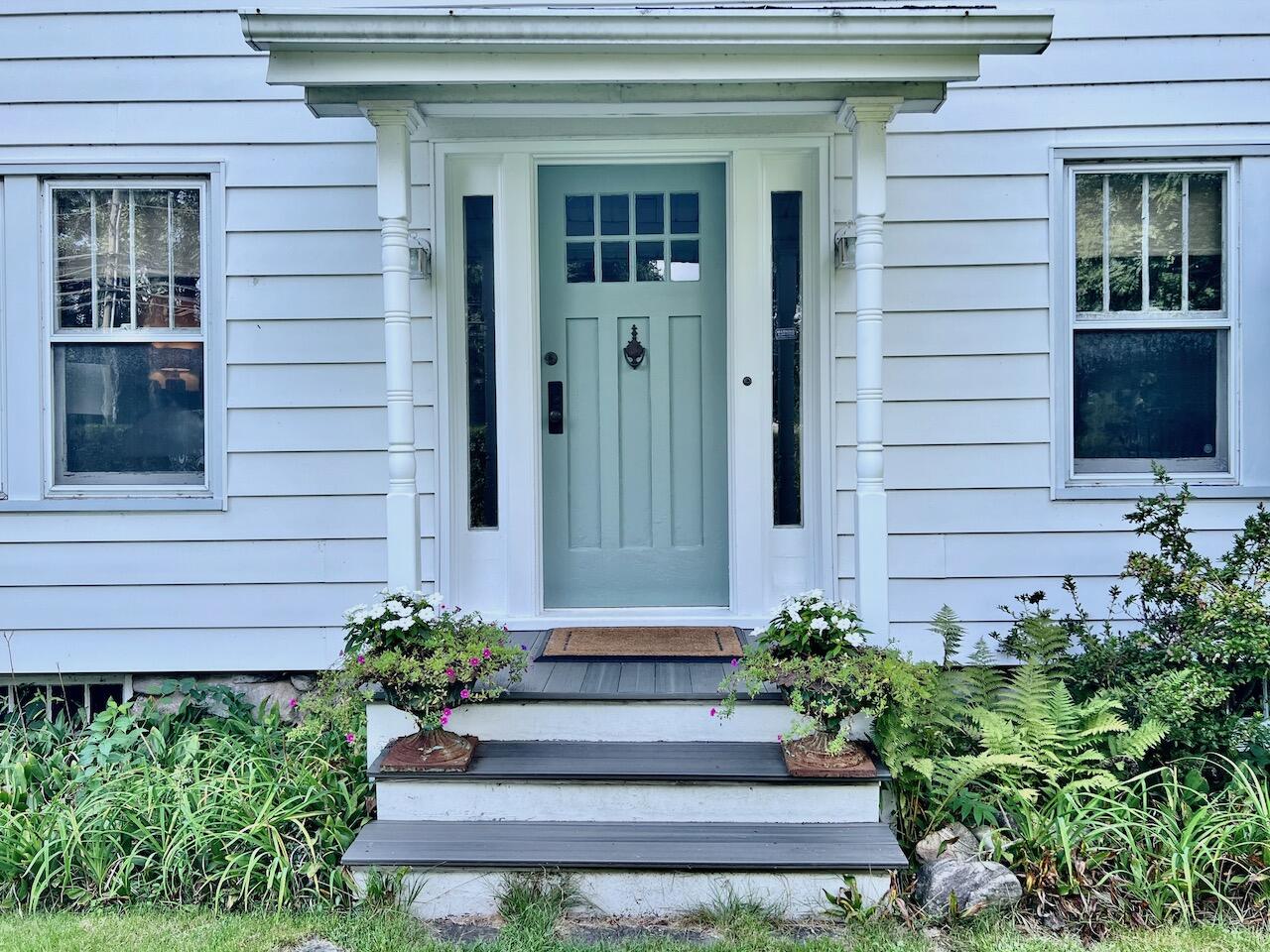 319 Rowayton Avenue Rowayton, CT 06853 - Photo 2 of 25 a front view of a house with a garden