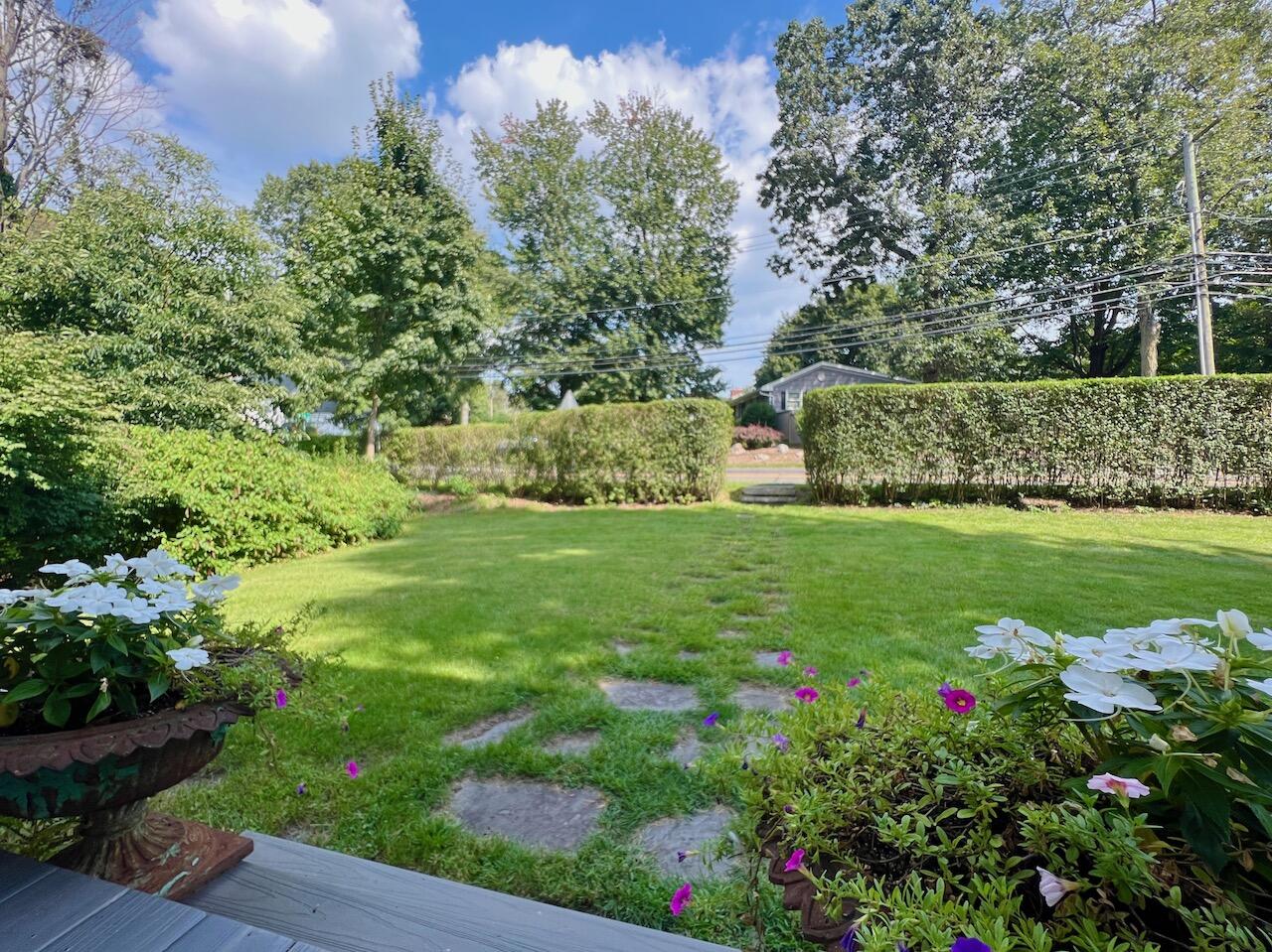 319 Rowayton Avenue Rowayton, CT 06853 - Photo 24 of 25 a view of a garden with a fountain