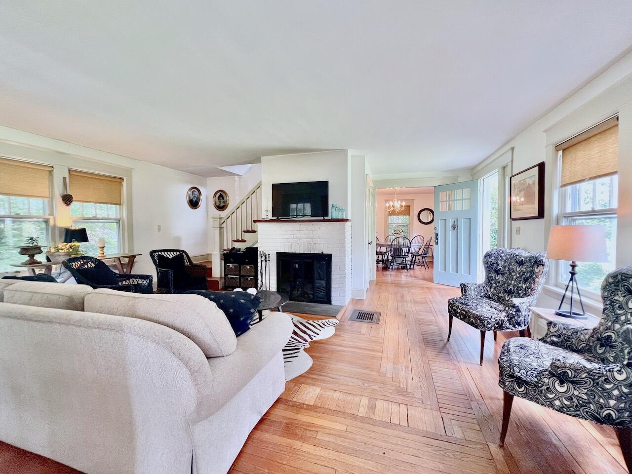 319 Rowayton Avenue Rowayton, CT 06853 - Photo 5 of 25 a living room with furniture a fireplace and a flat screen tv