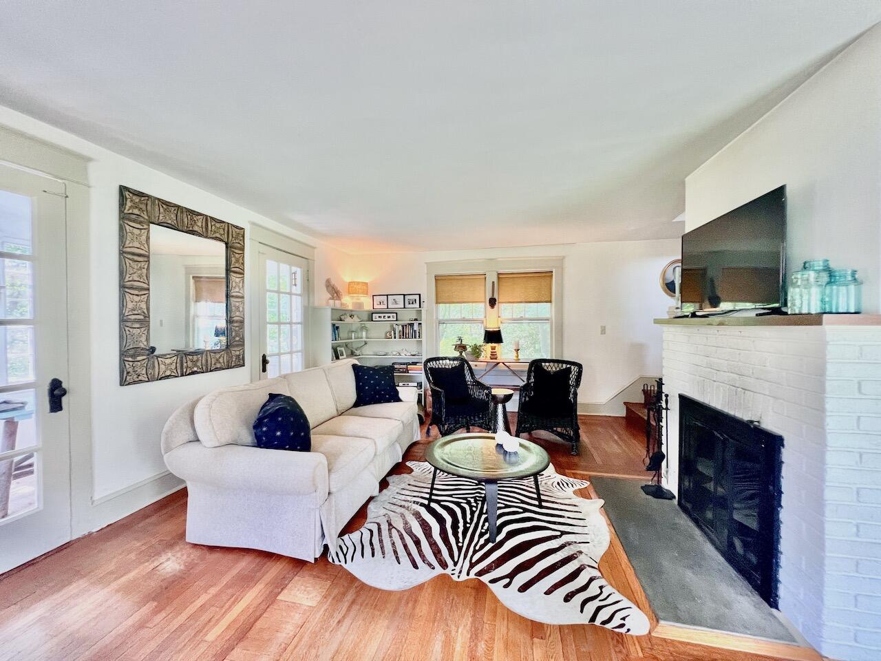 319 Rowayton Avenue Rowayton, CT 06853 - Photo 6 of 25 a living room with furniture fireplace and flat screen tv
