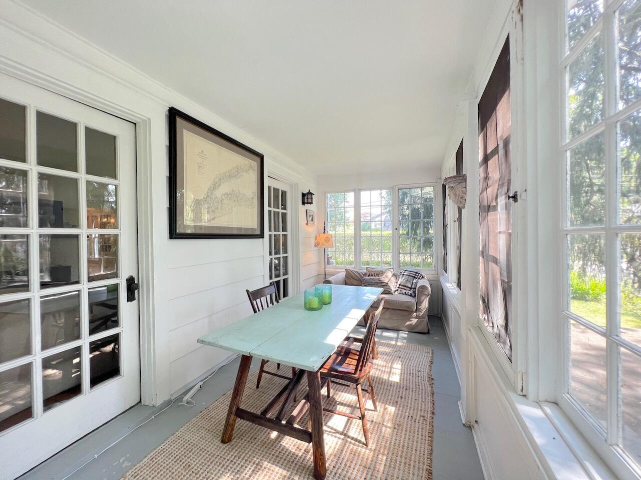 319 Rowayton Avenue Rowayton, CT 06853 - Photo 10 of 25 a view of a dining room with furniture window and wooden floor