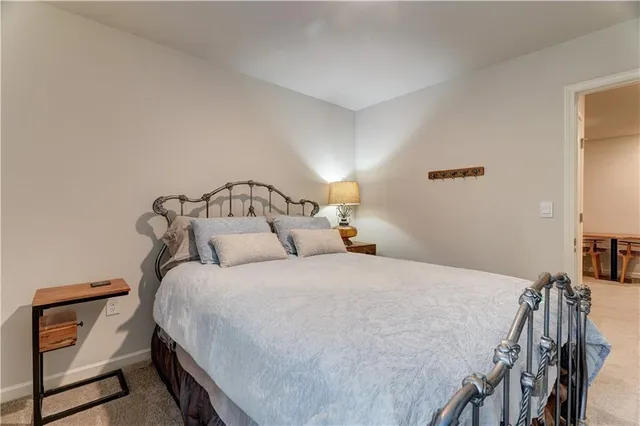 a living room with furniture fireplace and a large window