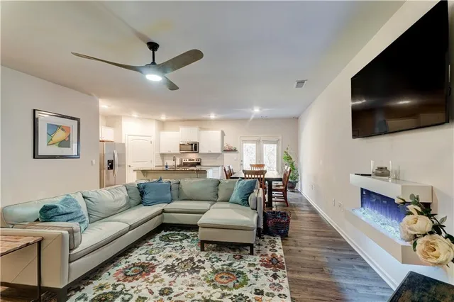 a kitchen with granite countertop a counter space stainless steel appliances and cabinets