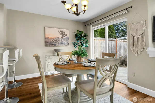 a view of a dining room with furniture window and outside view
