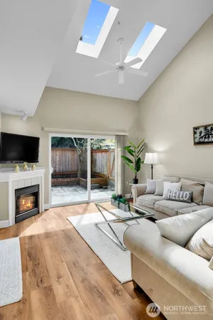 a living room with fireplace furniture and a flat screen tv