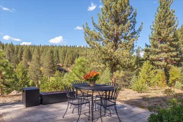 a kitchen with a dining table and chairs