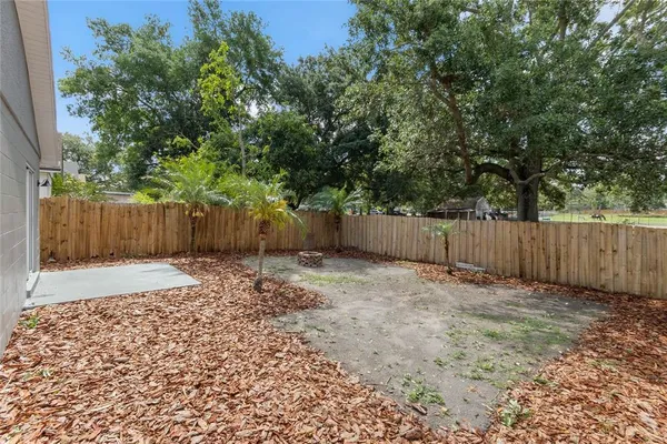 a backyard of a house with a garden
