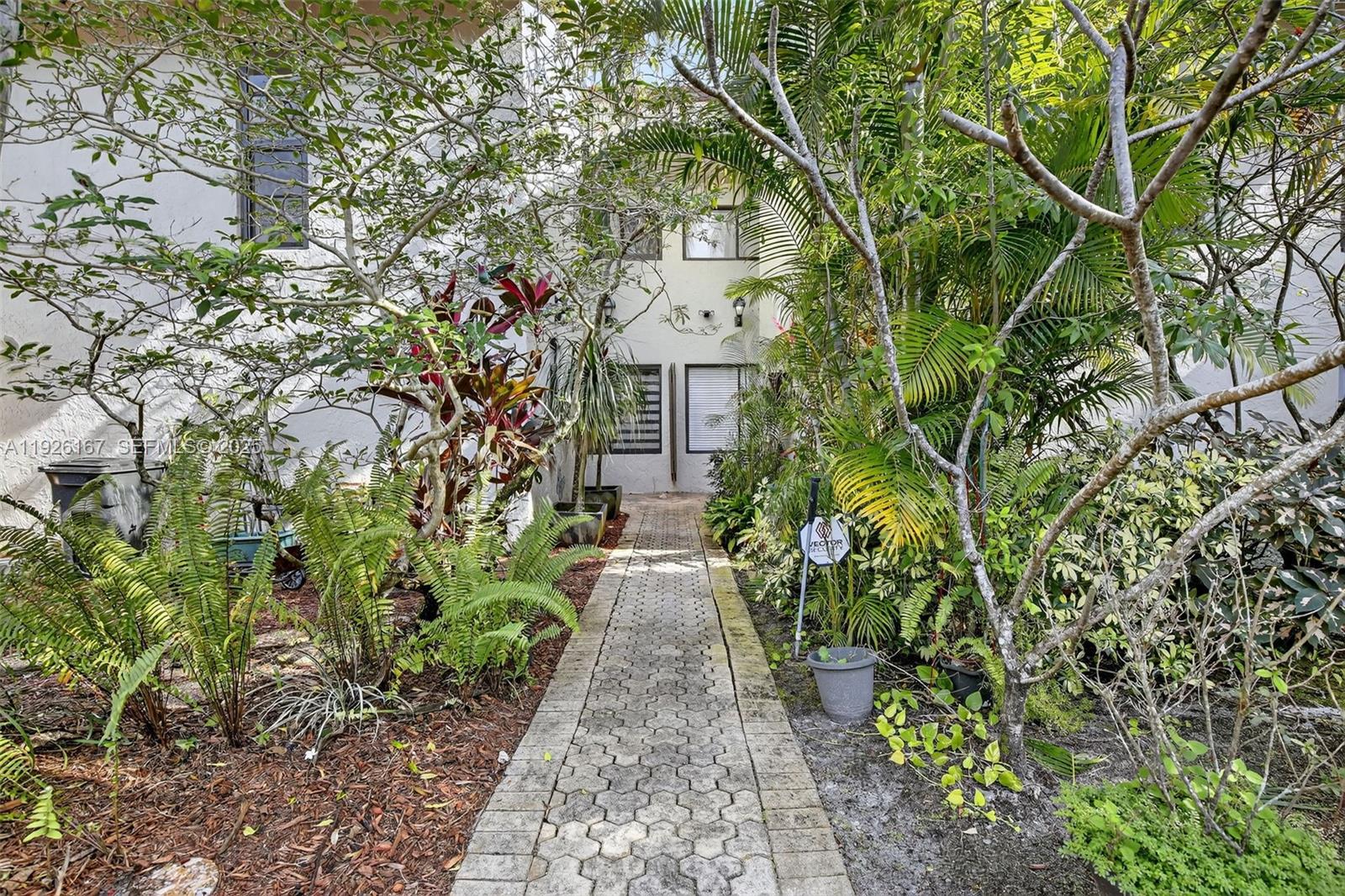 a front view of a house with lots of yellow lighting