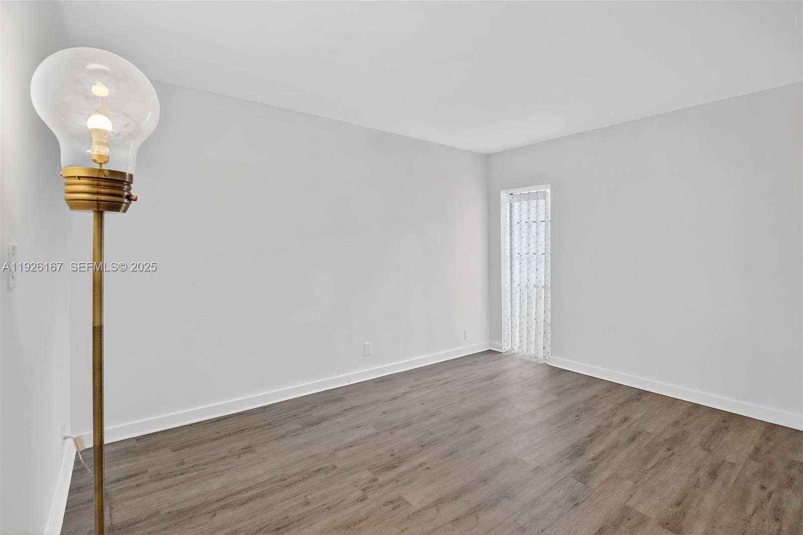 9703 North New River Canal Road, Unit 103 Plantation, FL 33324 - Photo 13 of 32 a view of a livingroom with wooden floor