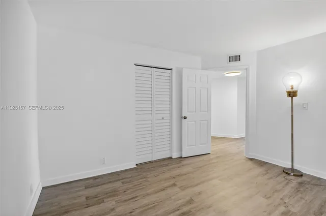 a bathroom with a sink vanity and mirror
